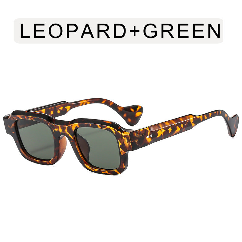 A woman wearing retro small square frames and simple sunglasses