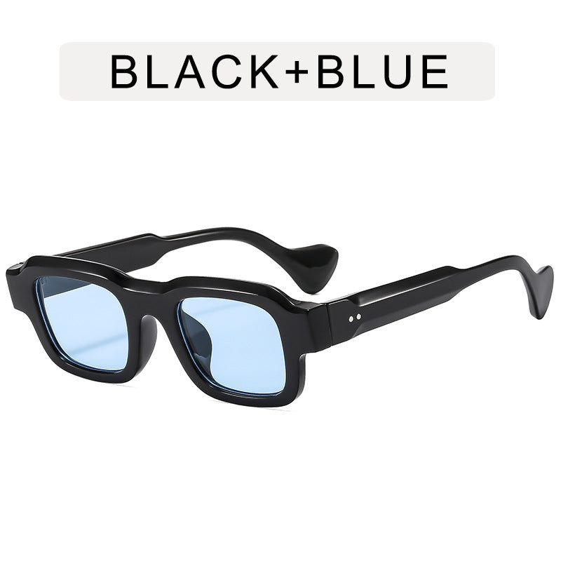 A woman wearing retro small square frames and simple sunglasses